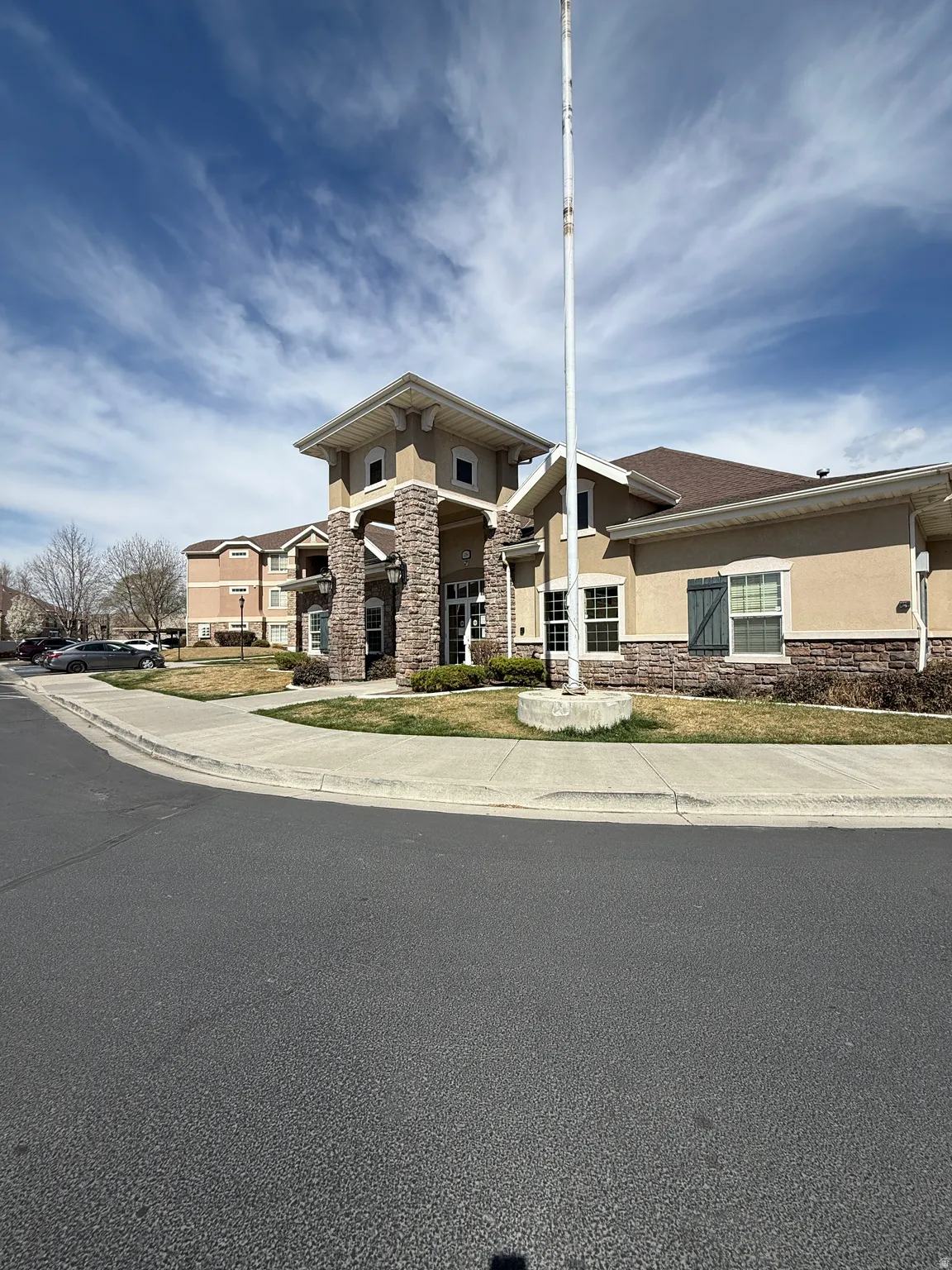 Prairie-style house with stucco siding and stone siding