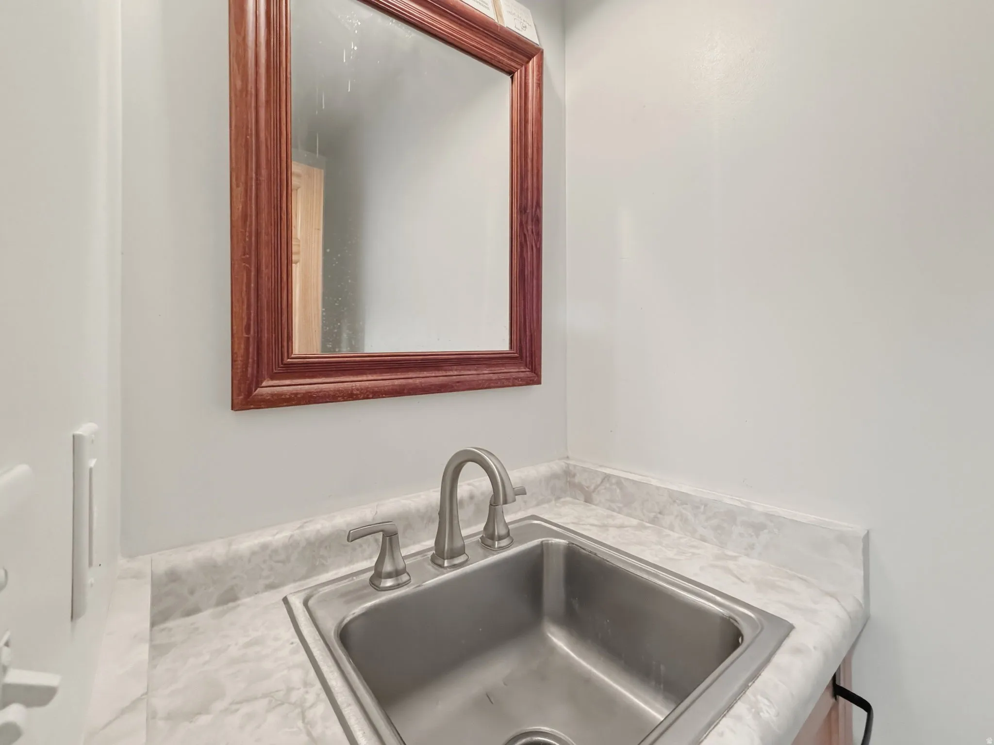 Half Bath next to laundry and garage