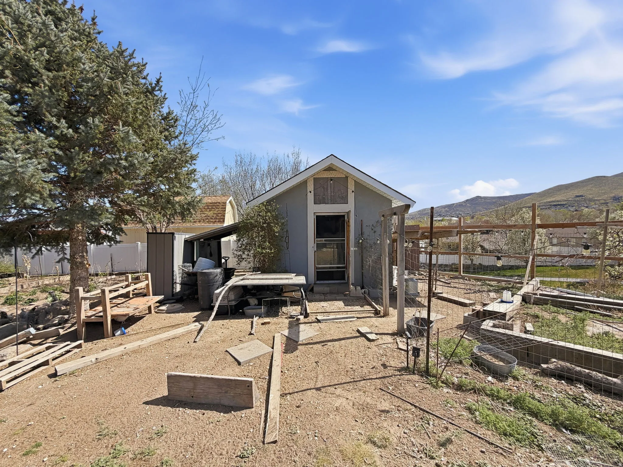 Chicken coop next to garden