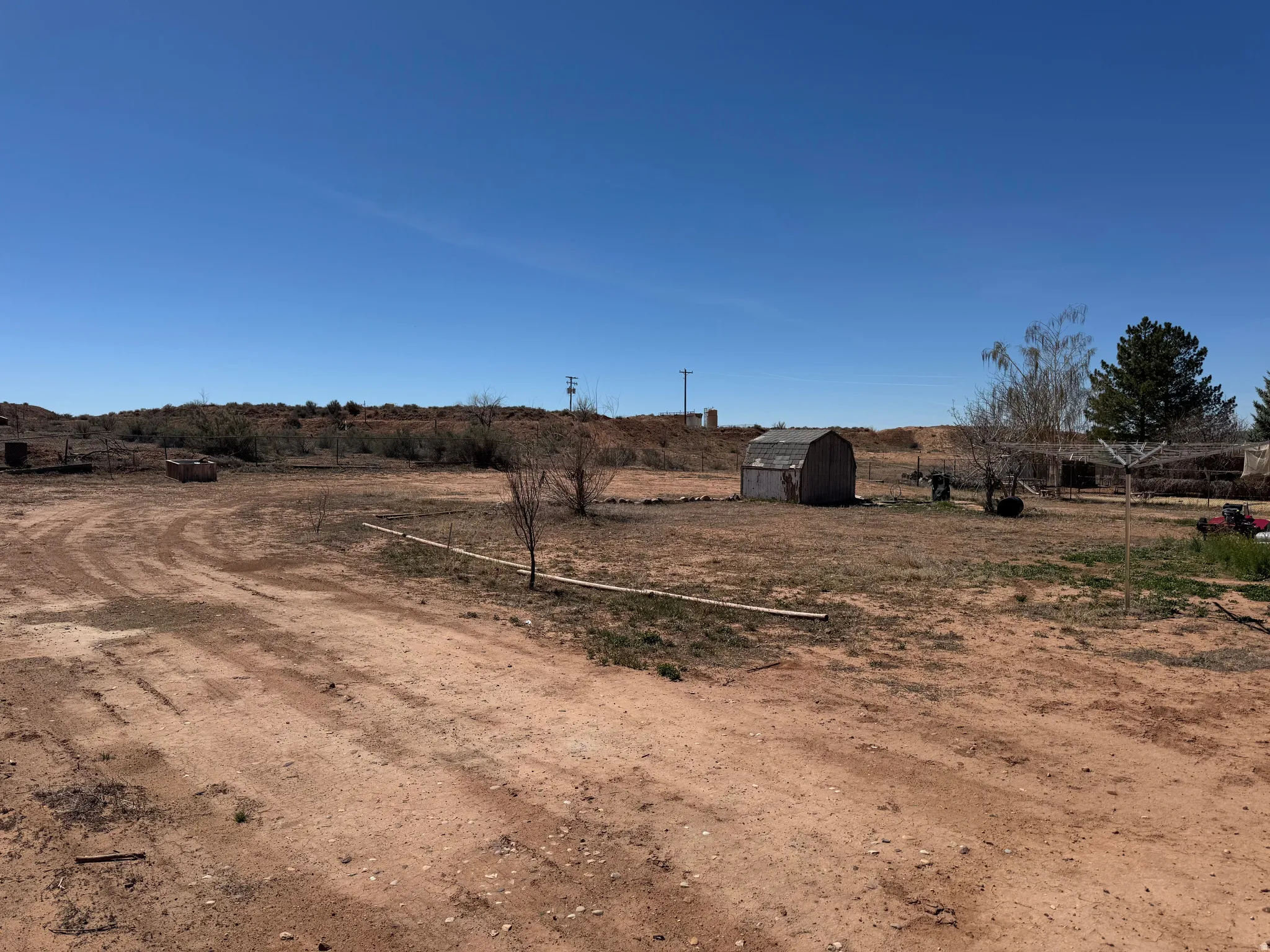 View of yard with a view of rural / pastoral area and a storage unit
