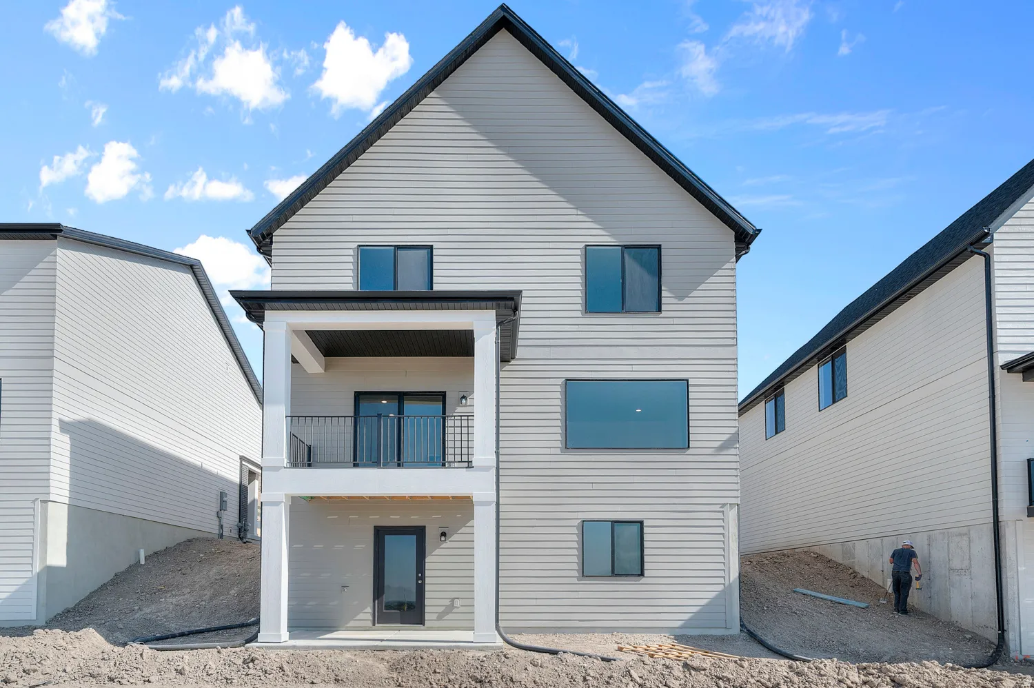 Rear view of property with a patio area and a balcony