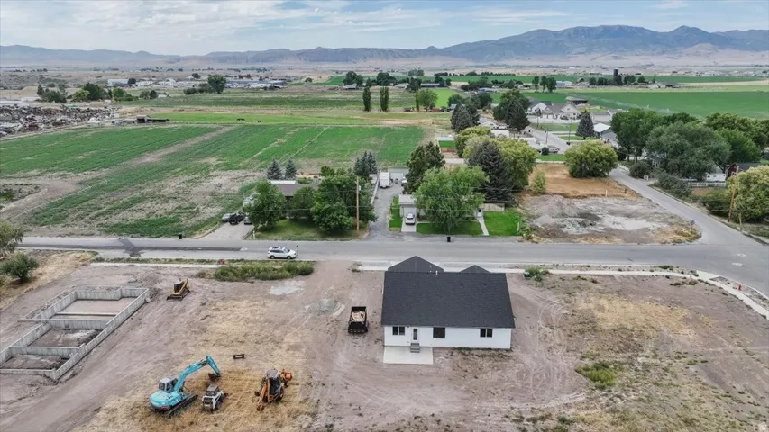 Aerial view of sparsely populated area featuring a mountain backdrop