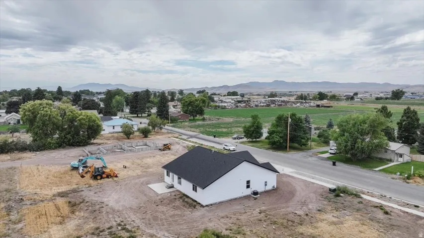 View from above of property with a mountainous background
