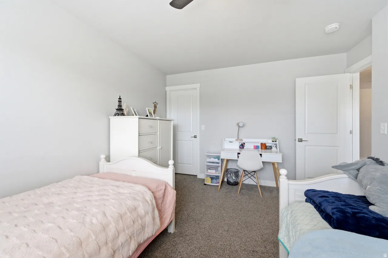 Bedroom featuring carpet flooring and a ceiling fan