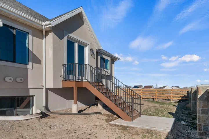 View of home's exterior featuring stucco siding