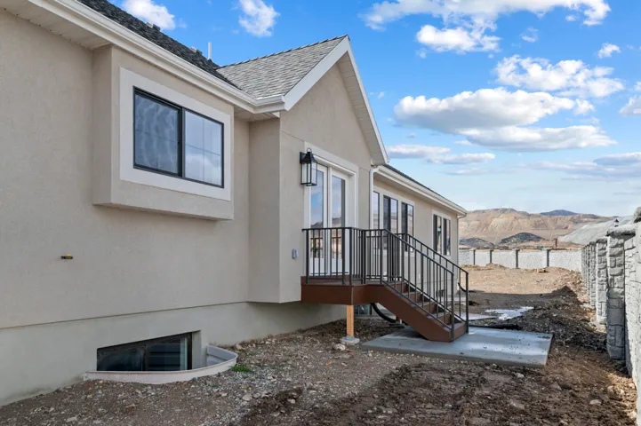 View of home's exterior featuring stucco siding and a mountain view