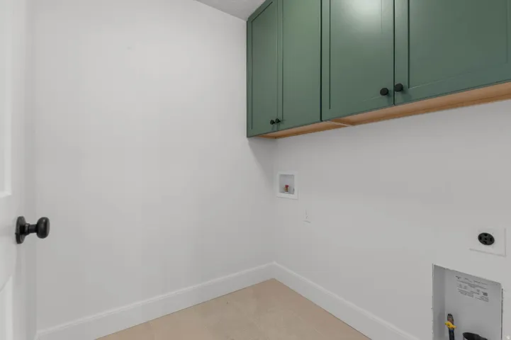 Laundry area with cabinet space, washer hookup, and electric dryer hookup
