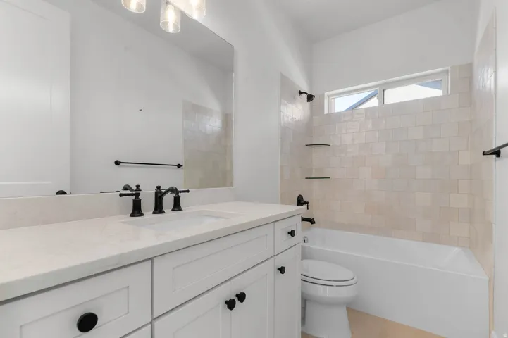 Bathroom featuring vanity and shower / bath combination