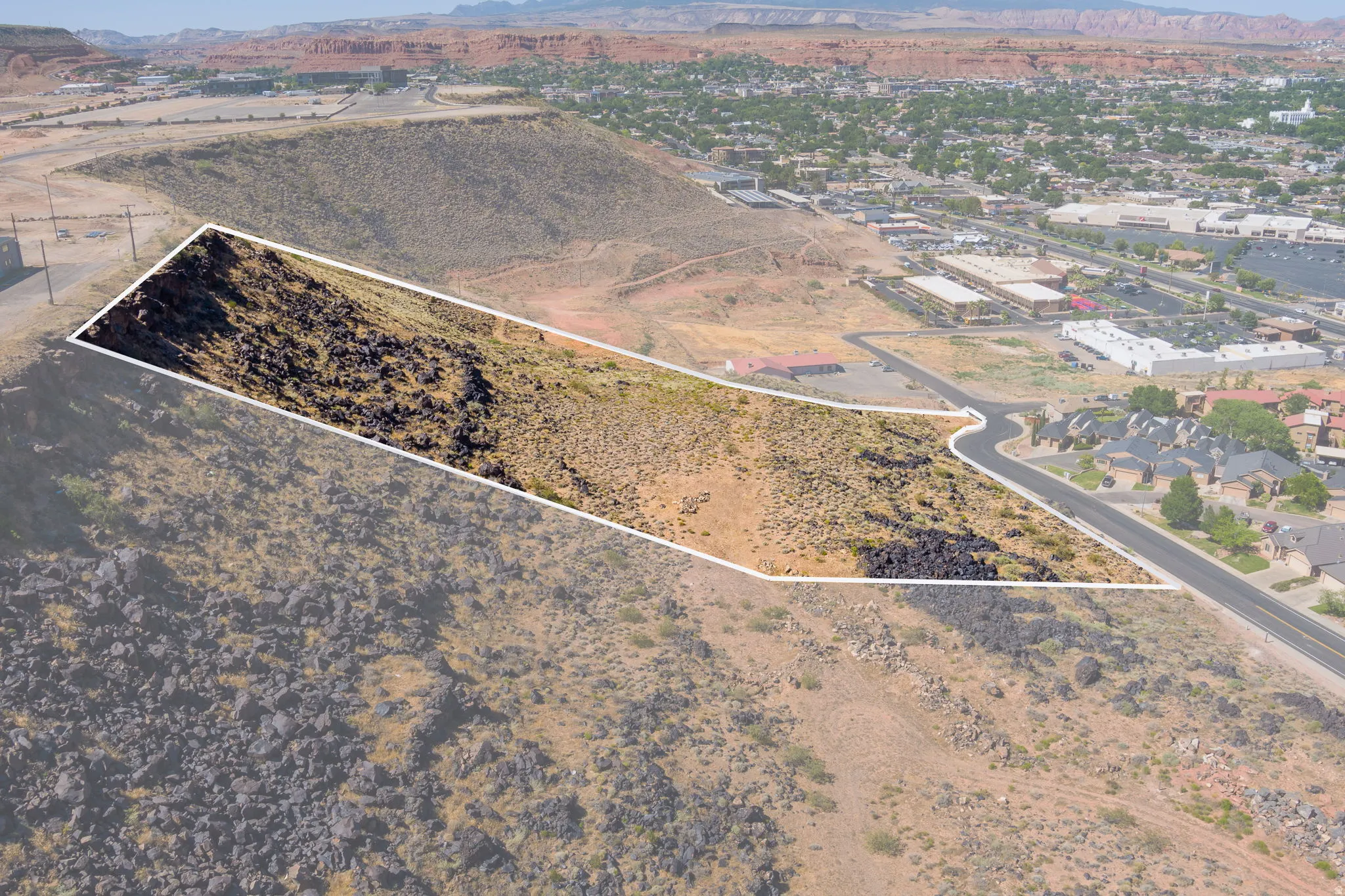 Aerial overview of property's location featuring mountains and property boundaries highlighted