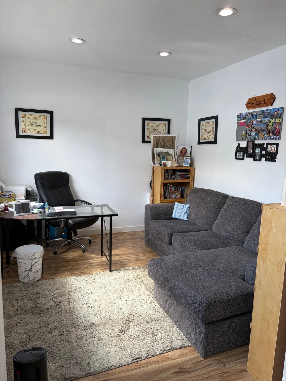Office space featuring wood finished floors and recessed lighting