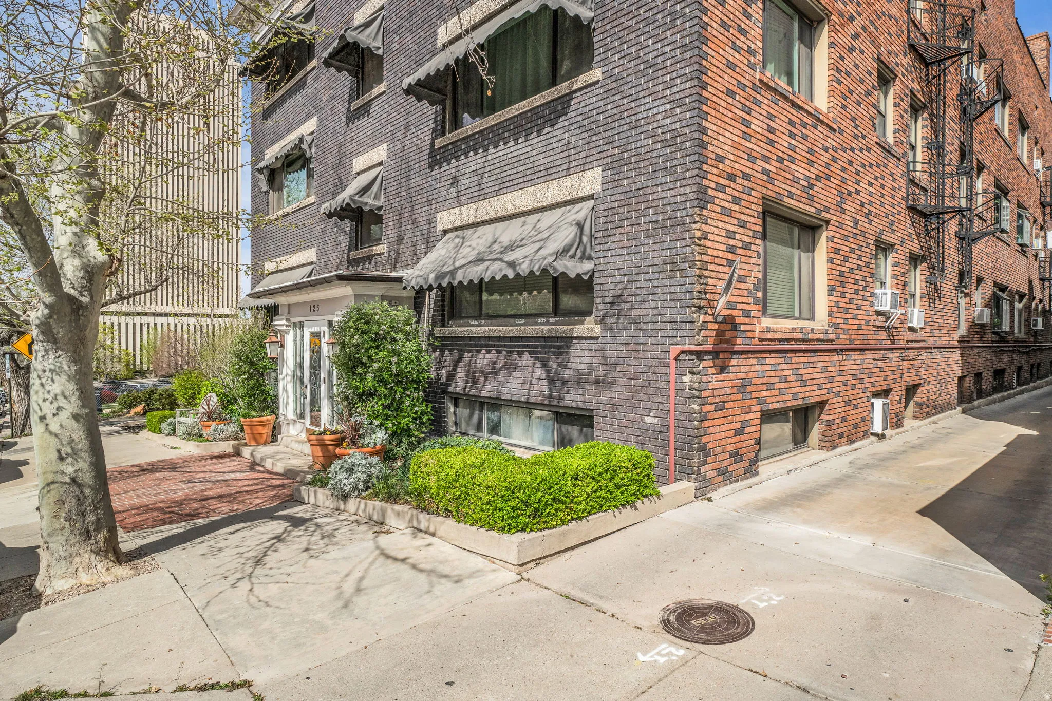 View of apartment building / complex featuring cooling unit