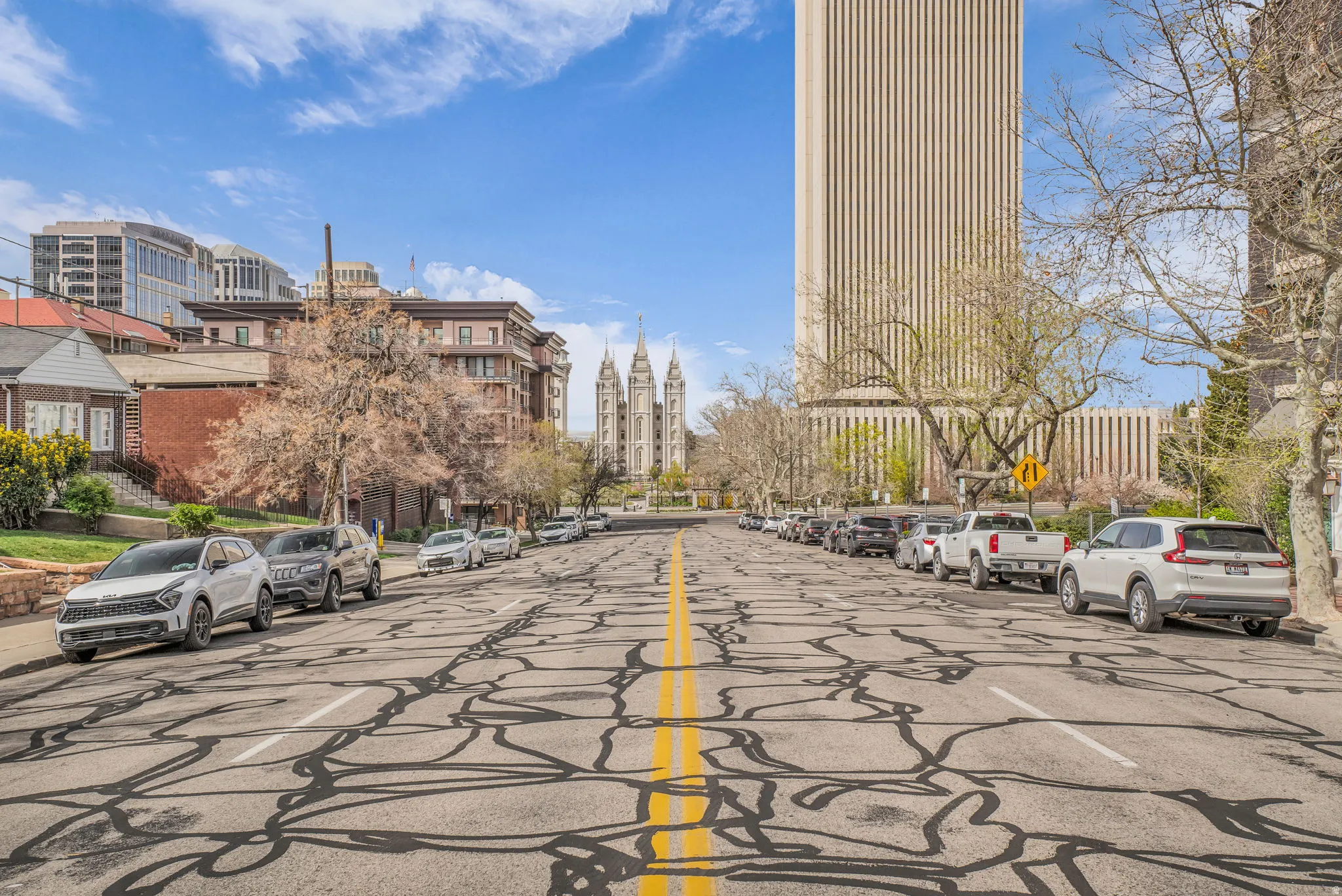 View of asphalt street with traffic signs