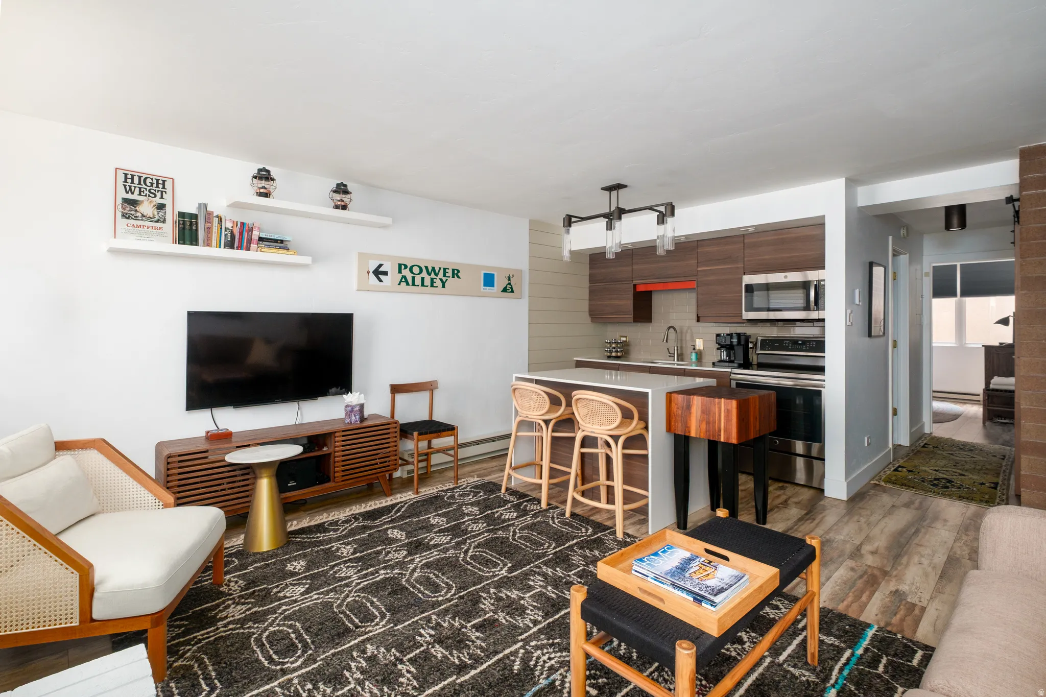 Living room featuring dark wood-style flooring