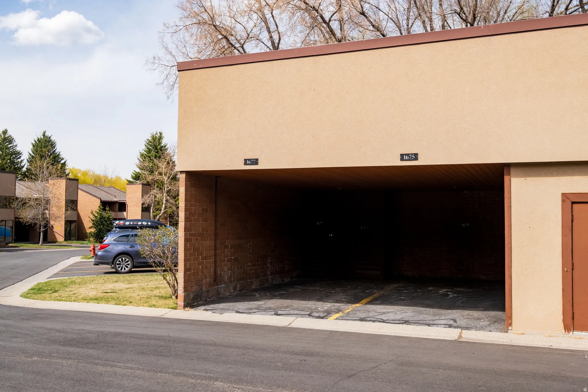 Garage featuring covered parking
