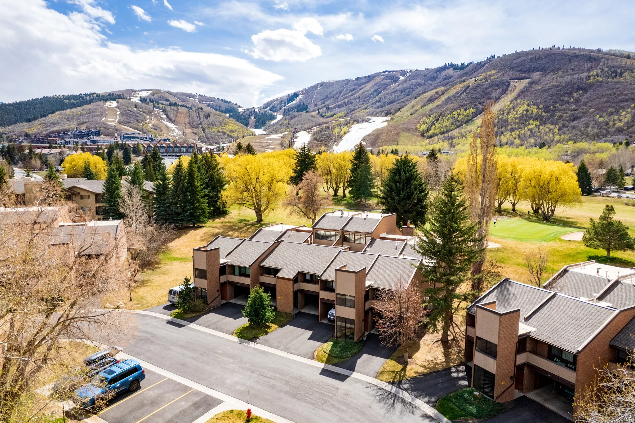 Bird's eye view of mountains and a golf club