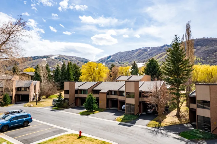 View of mountain backdrop featuring nearby suburban area