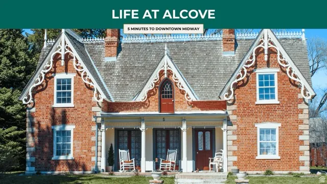 View of front of home with a chimney, brick siding, covered porch, and a front lawn