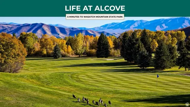 View of home's community with view of golf course and a mountain view