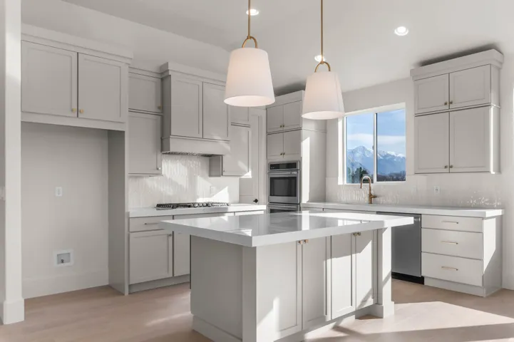 Kitchen with light wood finished floors, decorative backsplash, a kitchen island, decorative light fixtures, and stainless steel appliances