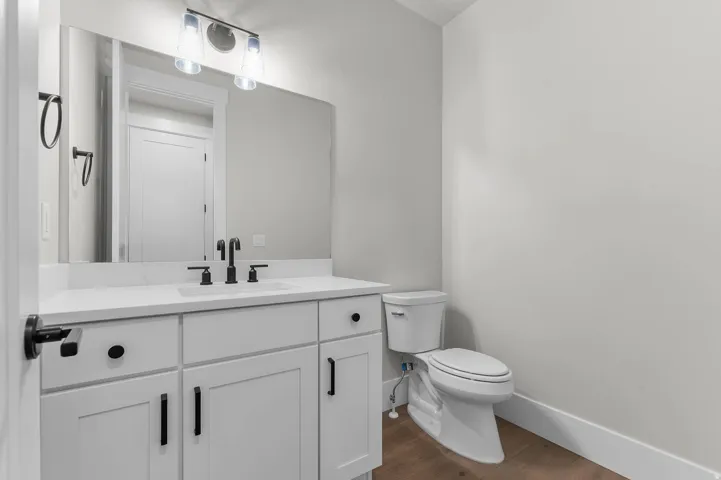 Bathroom with vanity and dark wood finished floors