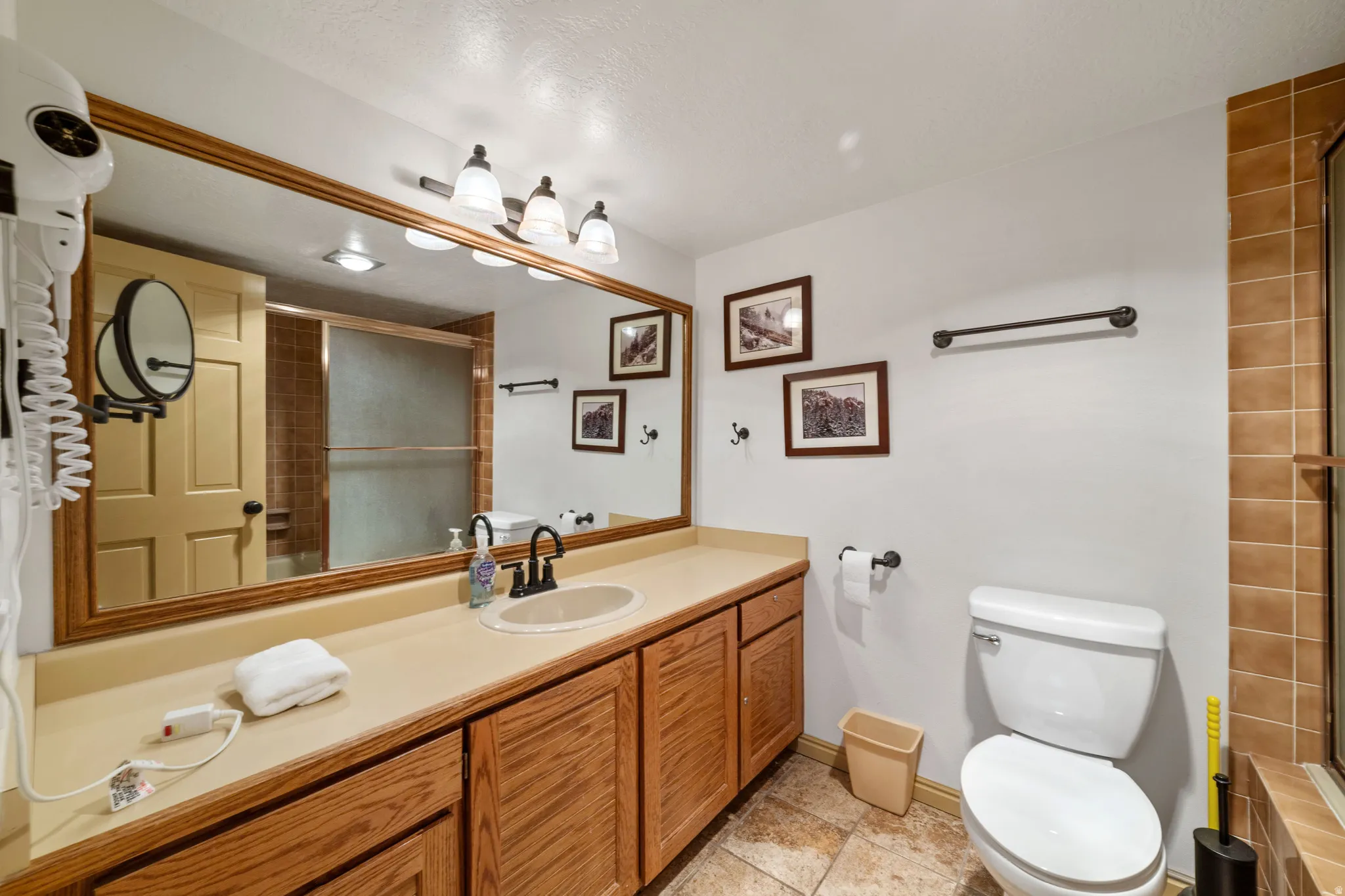 Full bathroom featuring vanity and a shower with shower door