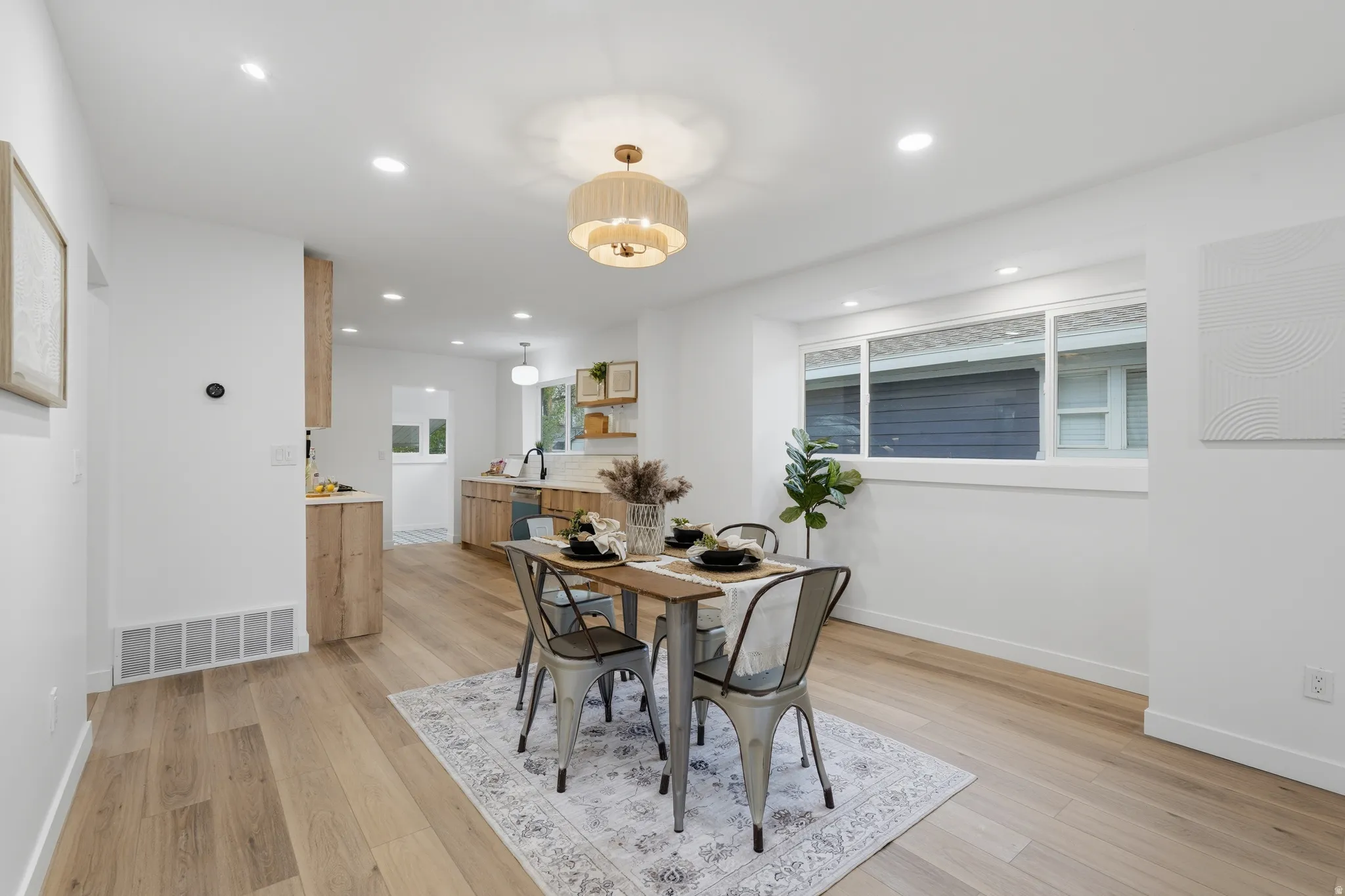 Dining room featuring light wood-type flooring and recessed lighting