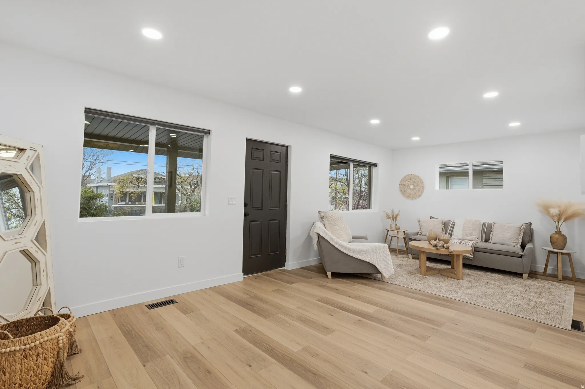 Living room featuring light wood-type flooring and recessed lighting