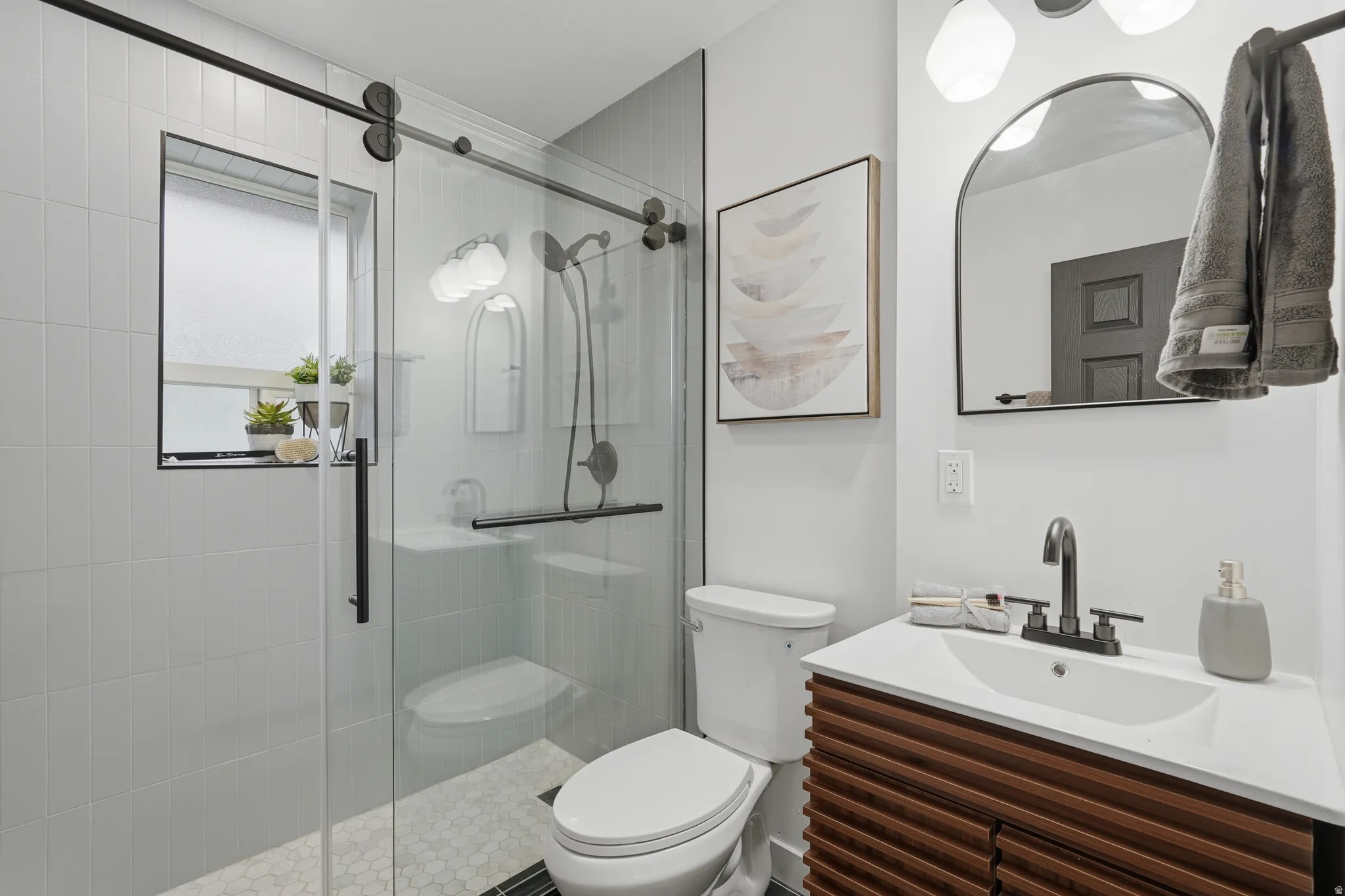 Full bath with vanity and a shower stall