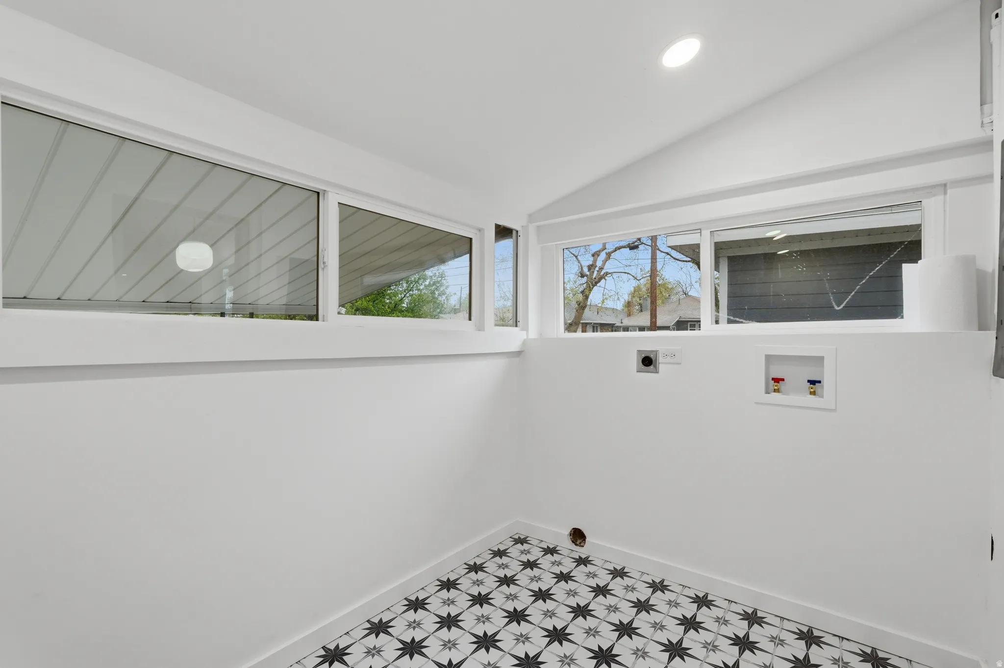 Laundry area featuring lofted ceiling, hookup for an electric dryer, recessed lighting, and hookup for a washing machine