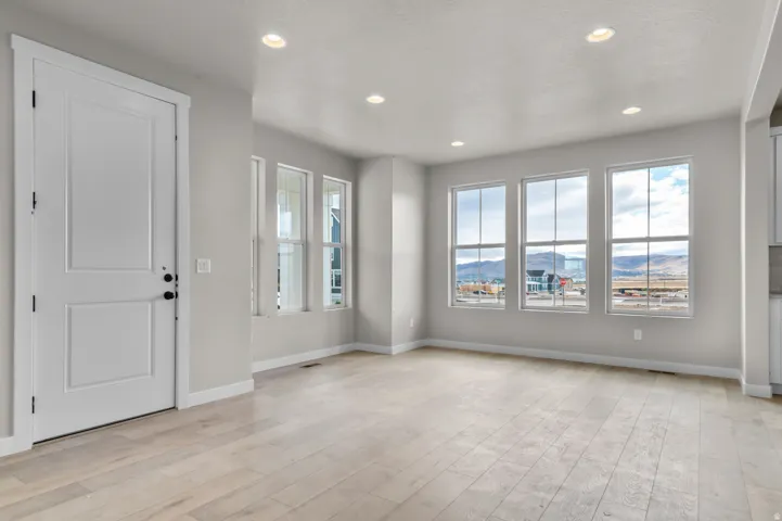 Foyer featuring a mountain view, light wood-type flooring, and recessed lighting