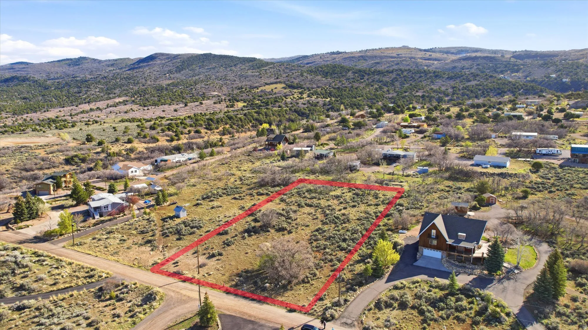 Expansive undeveloped parcel featuring natural terrain and sparse vegetation