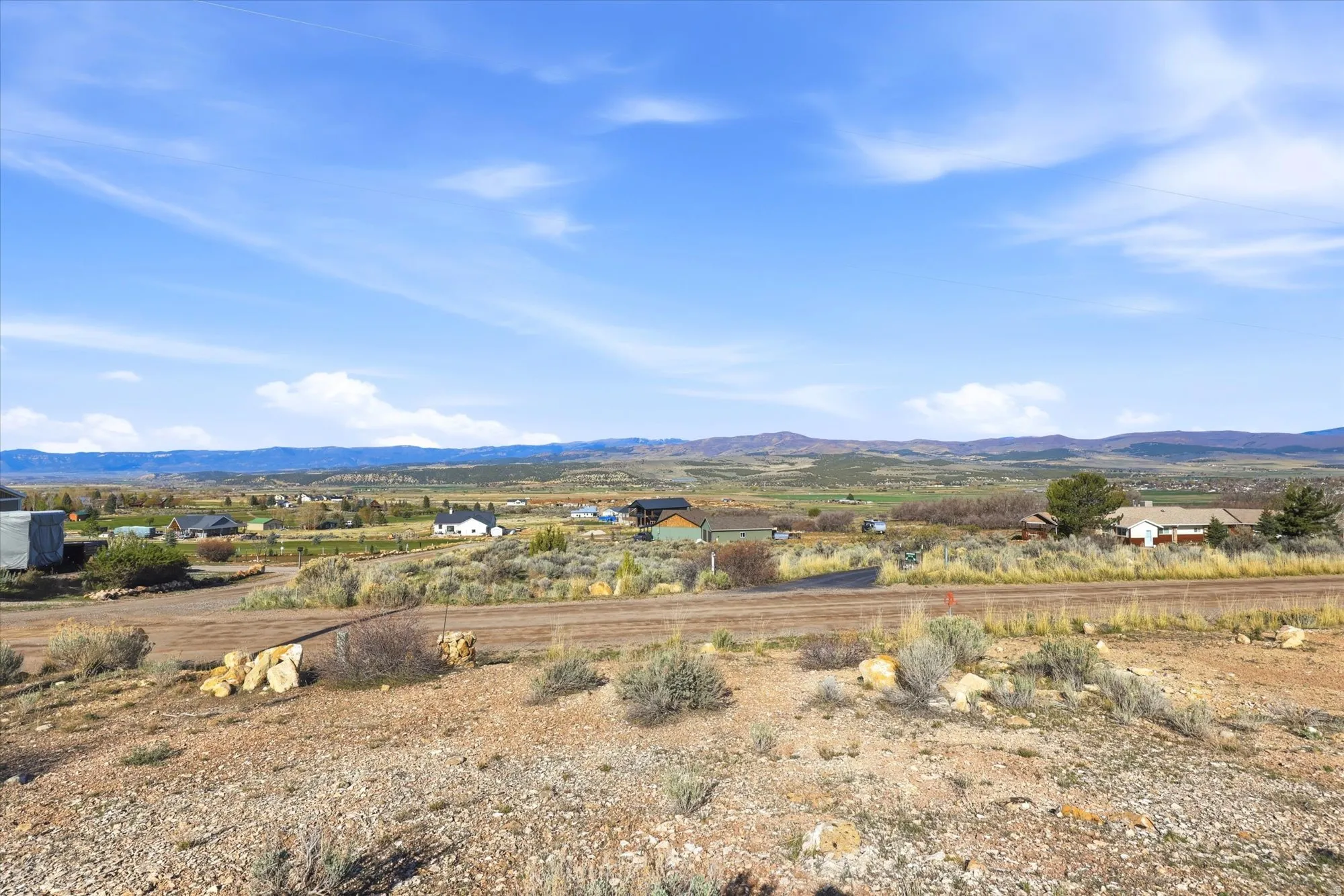 Expansive undeveloped parcel with a distant mountain backdrop