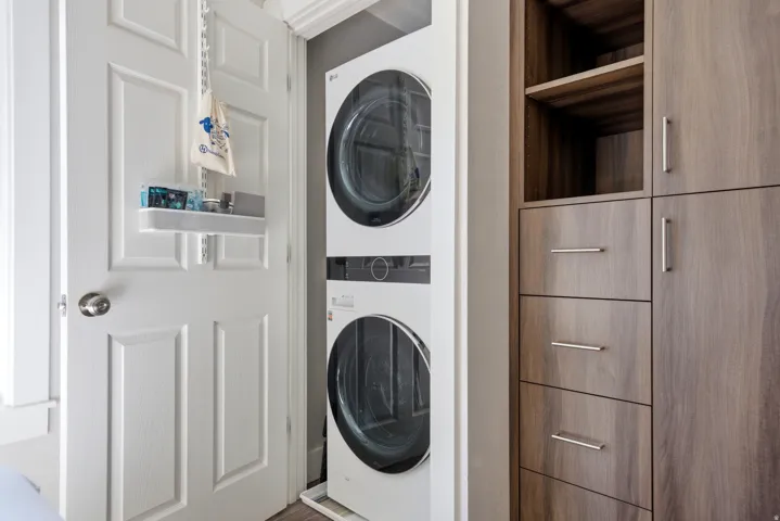 Laundry area featuring stacked washer / dryer
