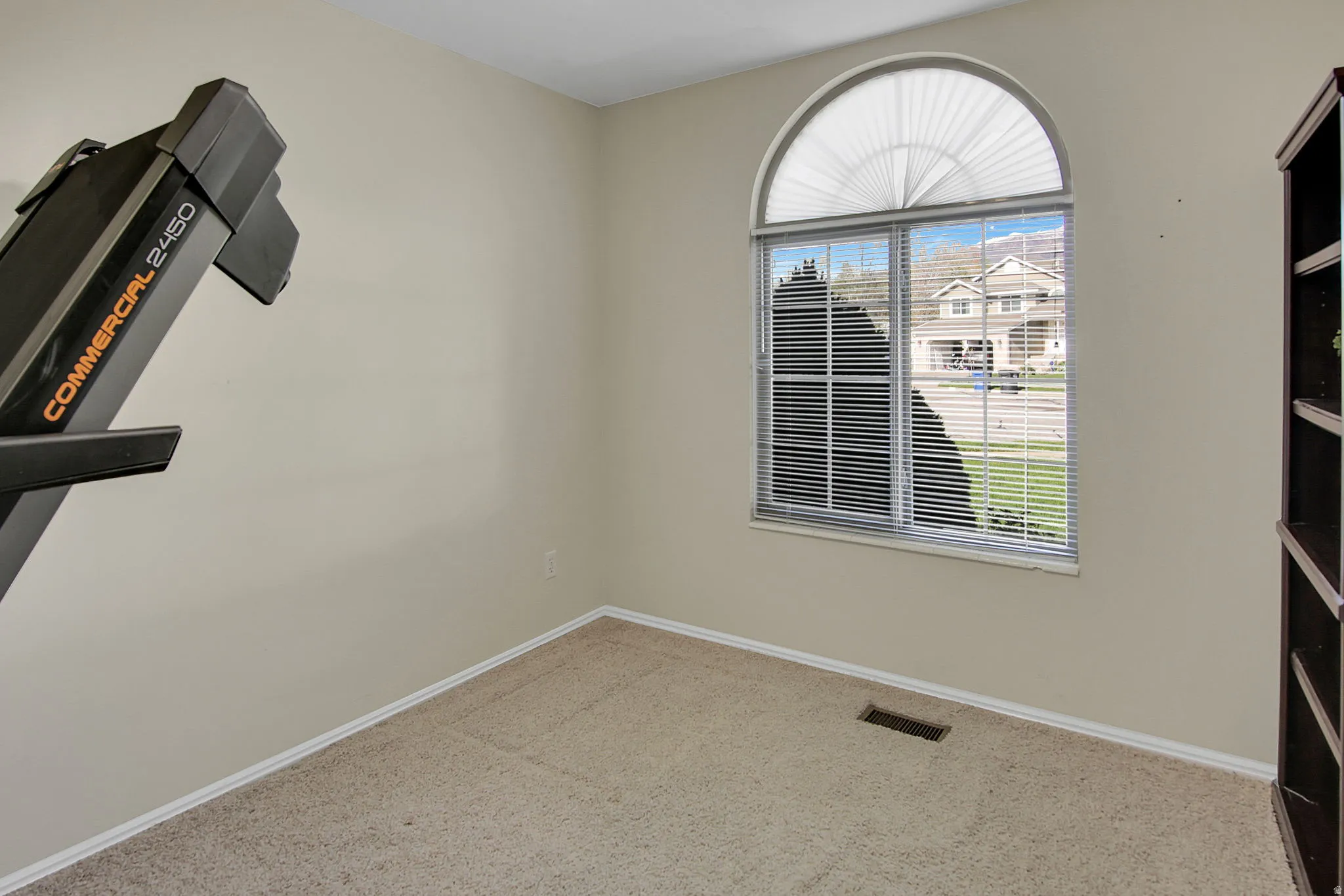 Empty room with baseboards and light carpet