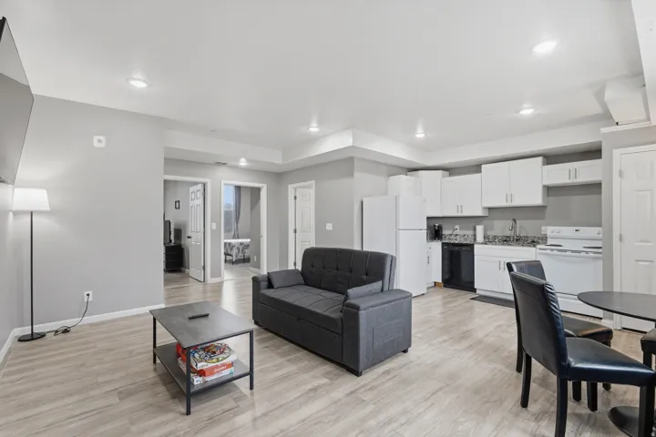 Living area featuring light wood-style flooring and recessed lighting