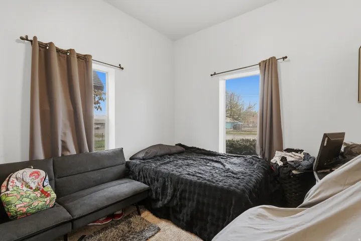 Bedroom featuring multiple windows