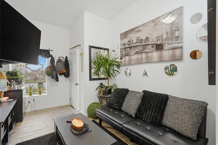 Living room with wood tiled floors and baseboards