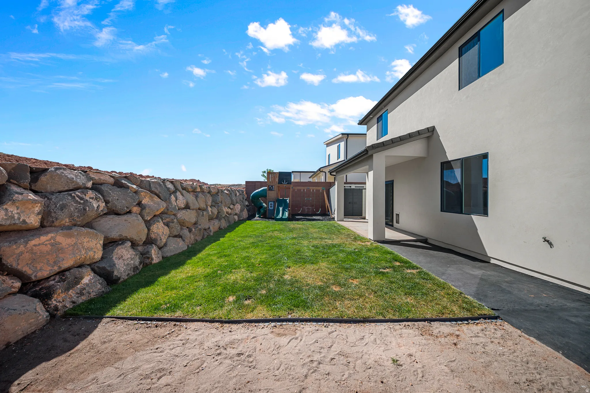 View of fenced backyard