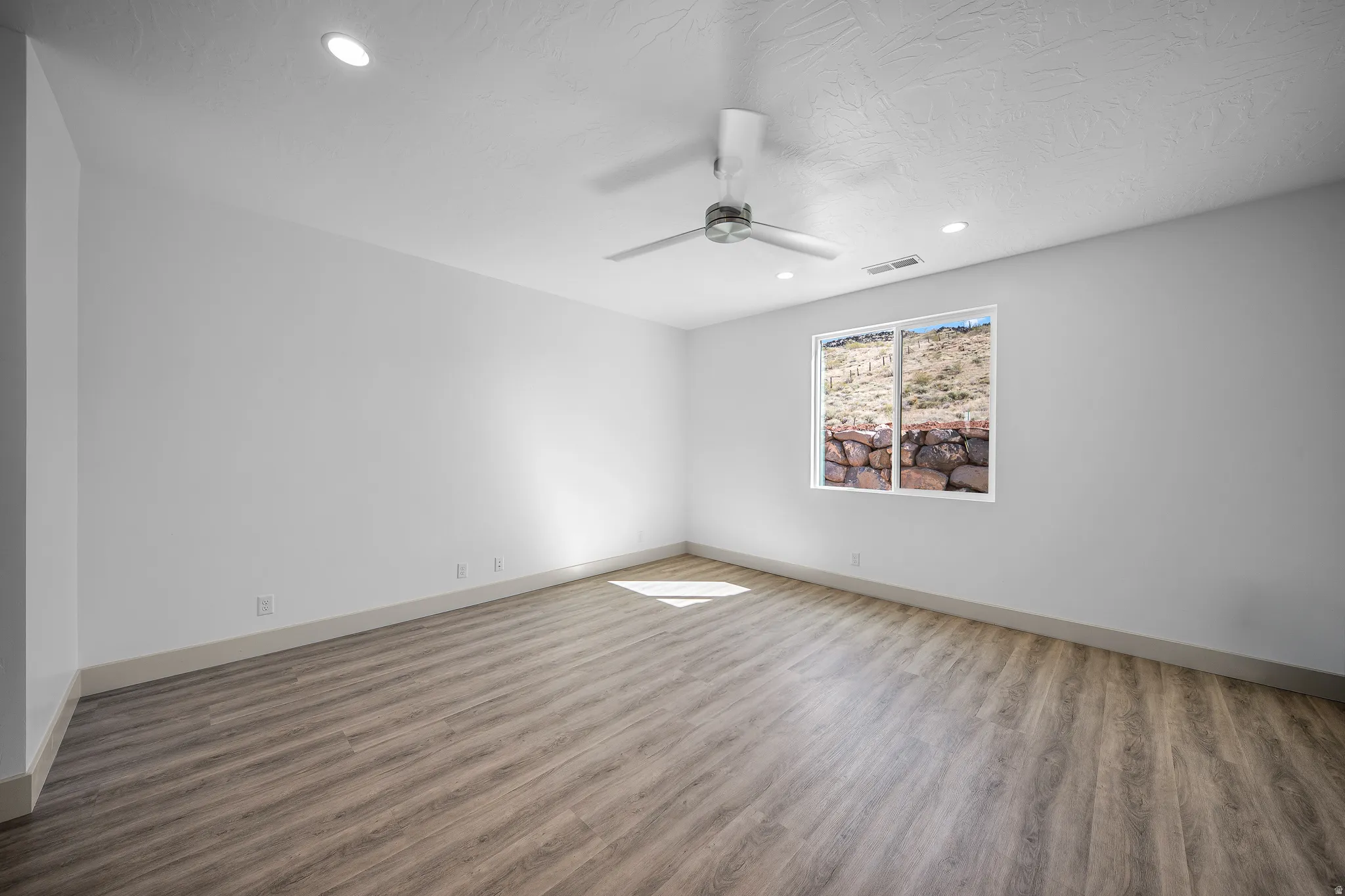 Unfurnished room with wood finished floors, recessed lighting, and ceiling fan