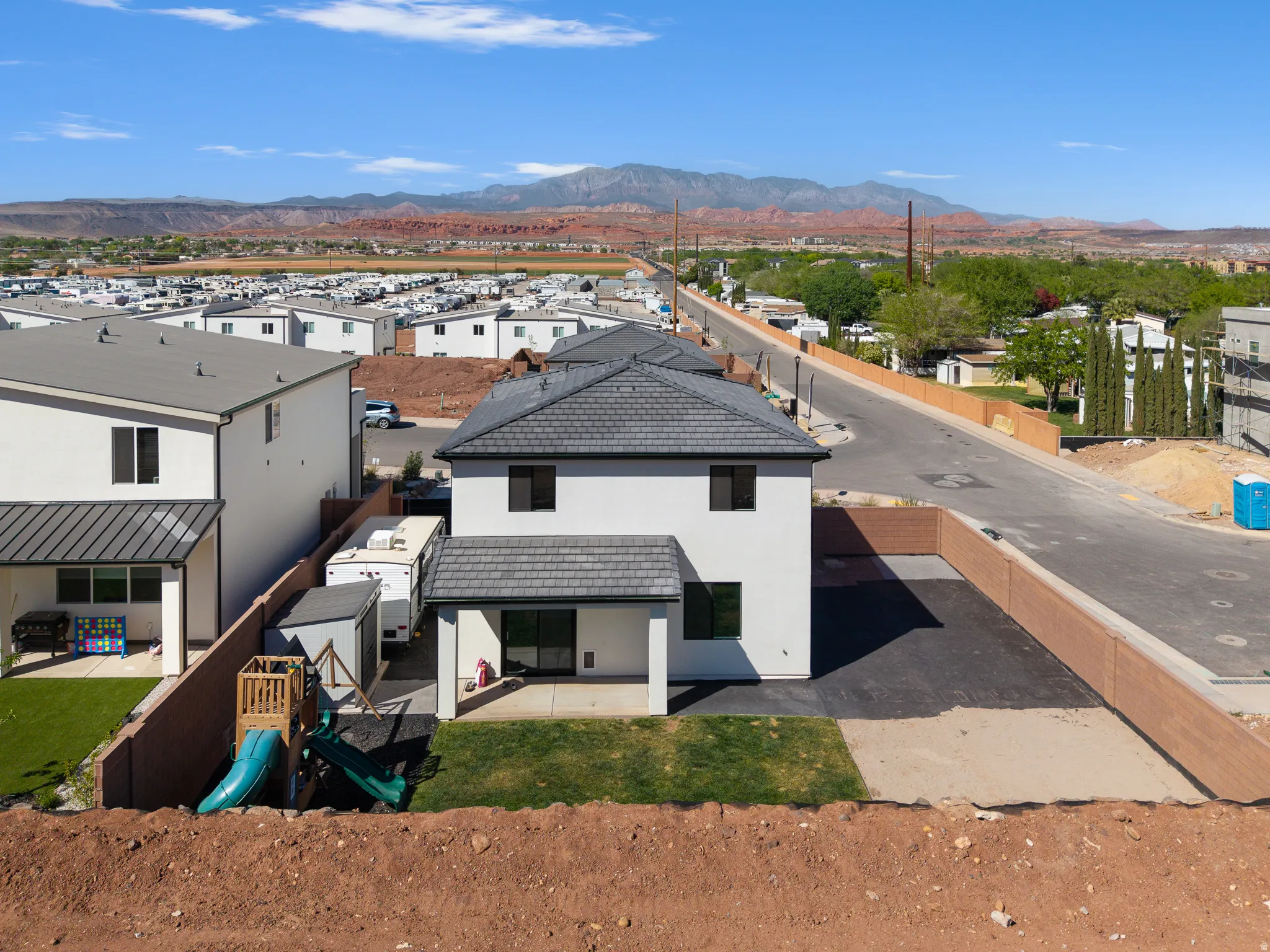 Aerial view of residential area featuring a mountain backdrop