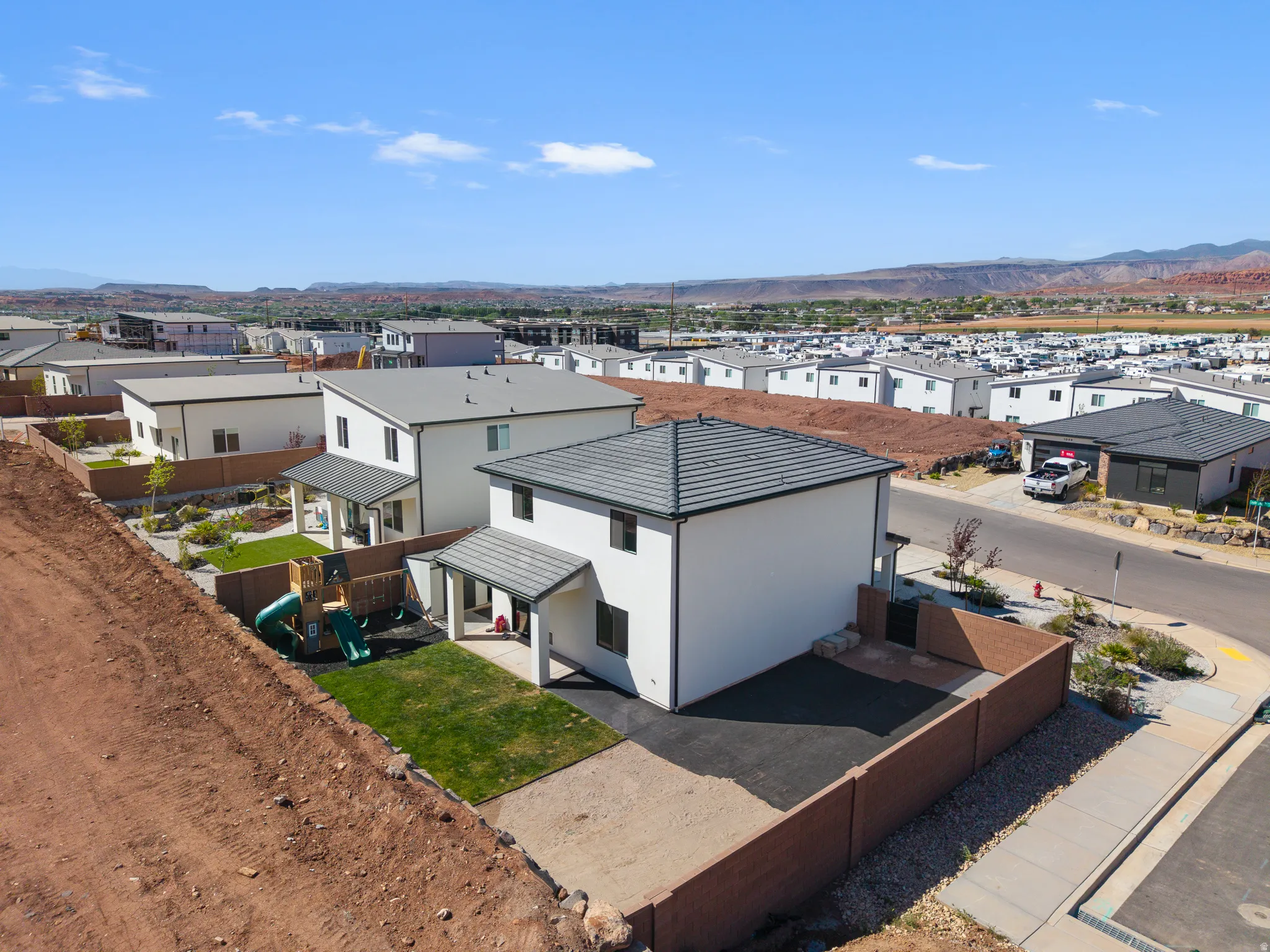 Aerial perspective of suburban area featuring a mountainous background
