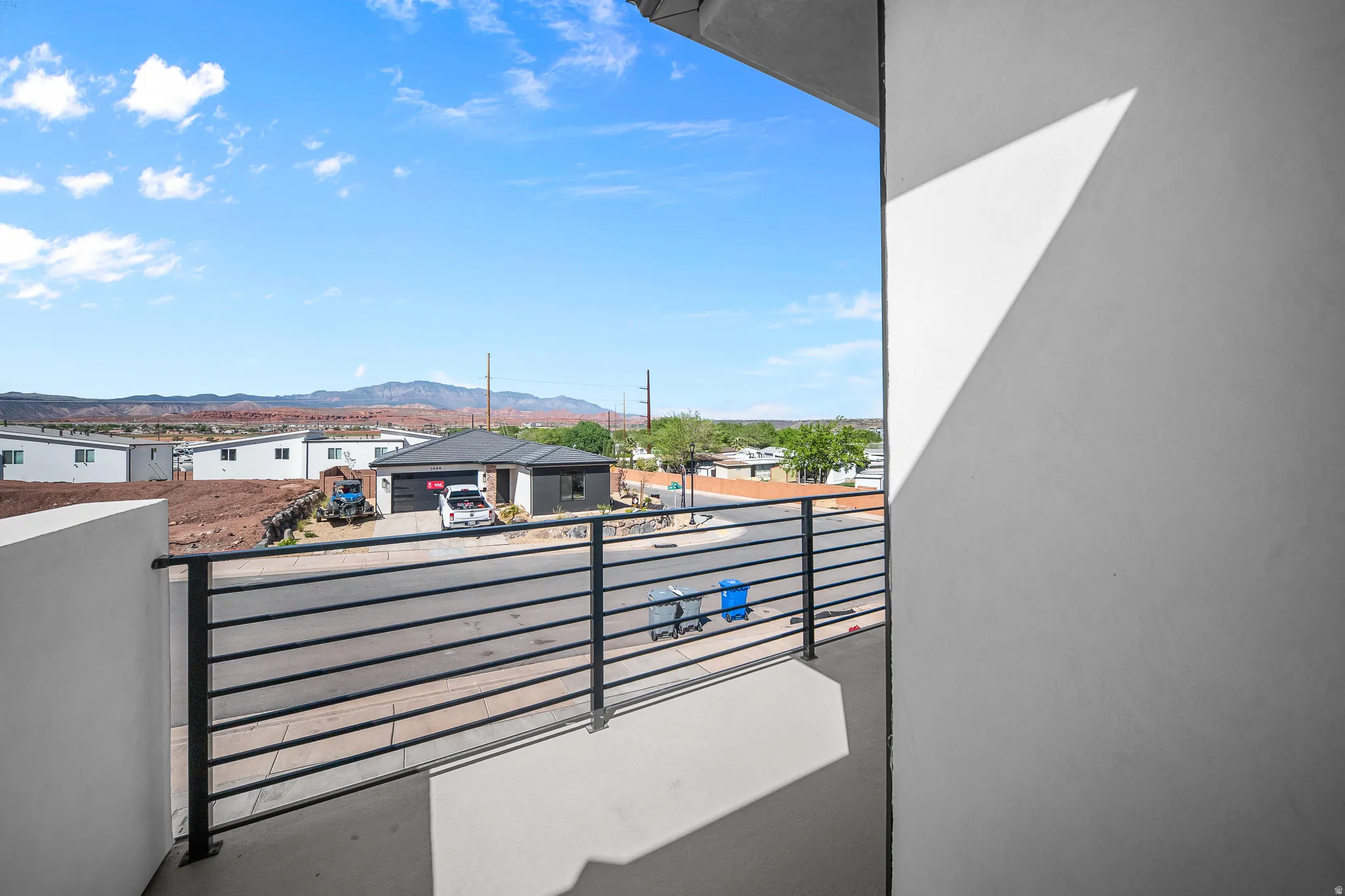 Balcony featuring a mountain view and a residential view