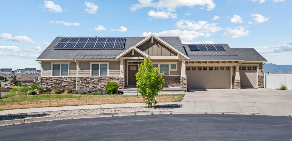 Contemporary single-story residence featuring a combination of horizontal siding and stone veneer
