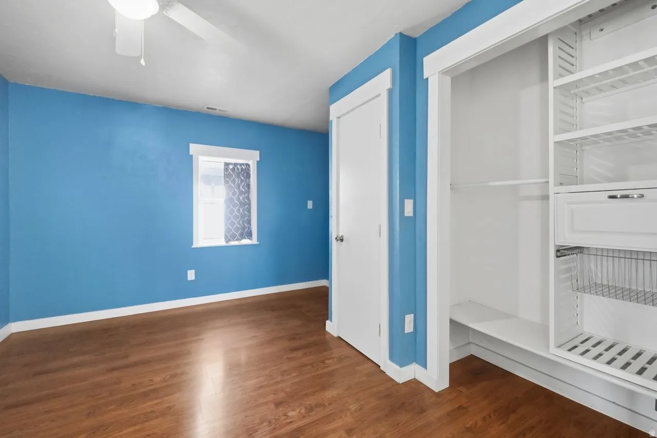 1st bedroom, a ceiling fan, and a closet with built-ins