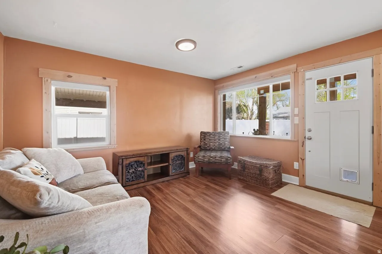 Living room featuring wood finished floors and baseboards