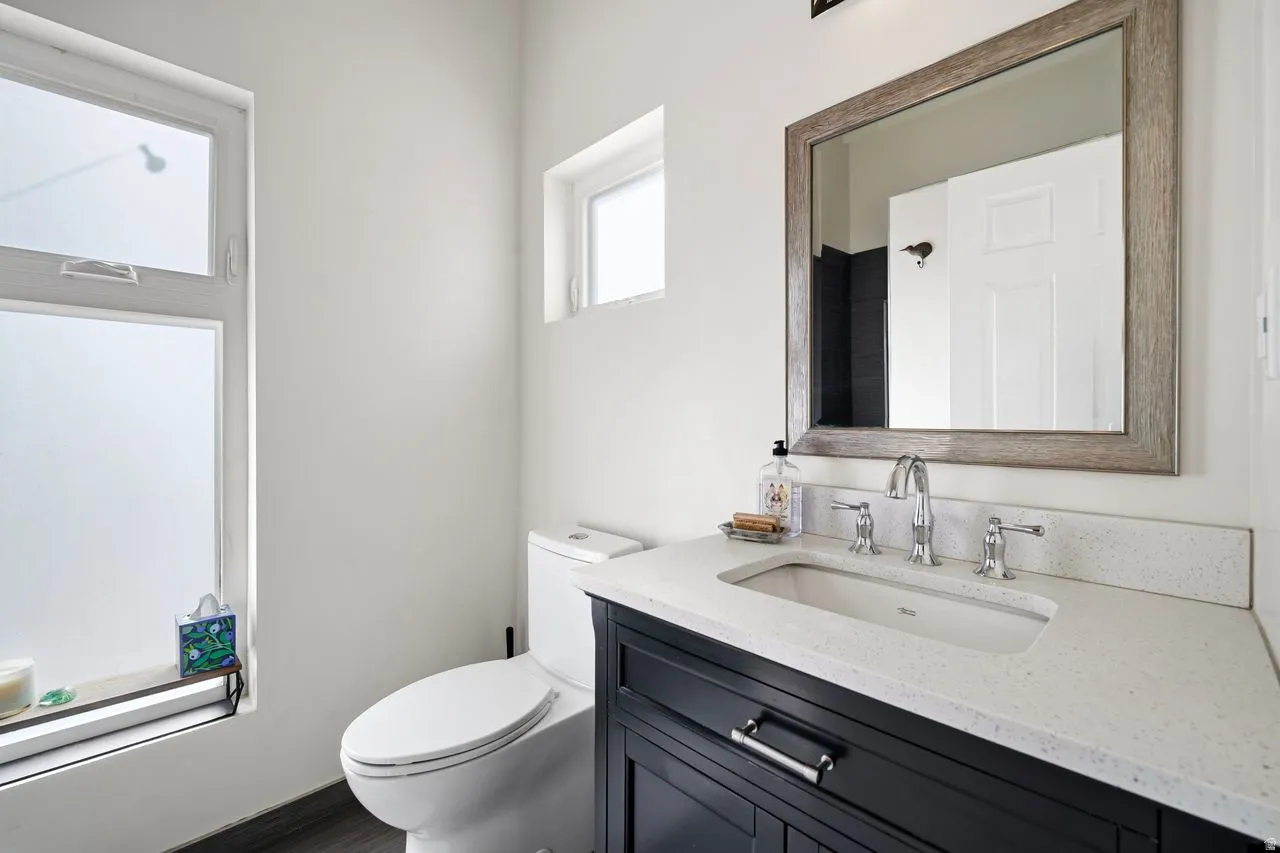 Primary bathroom featuring vanity and toilet & large shower