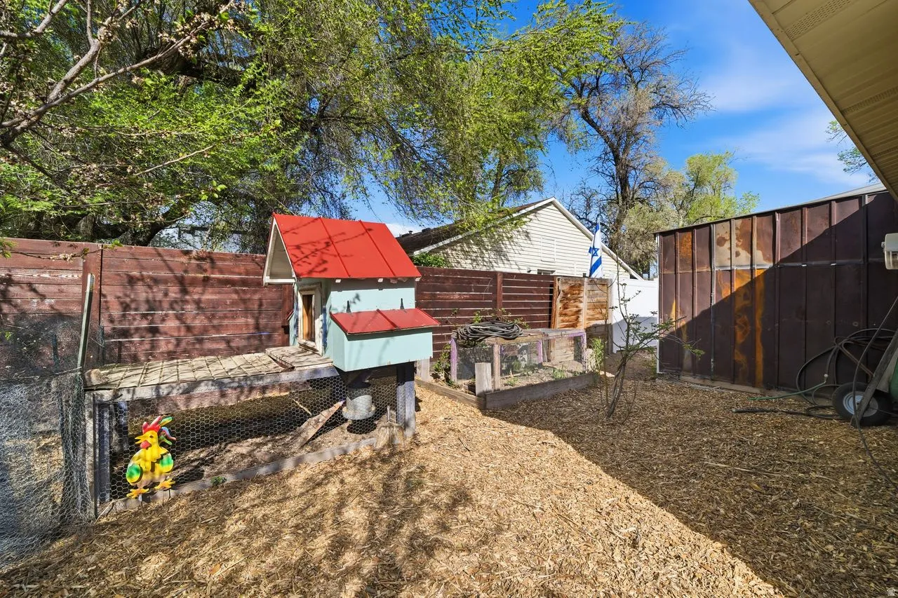 Fenced backyard, area for dog run or chickens,