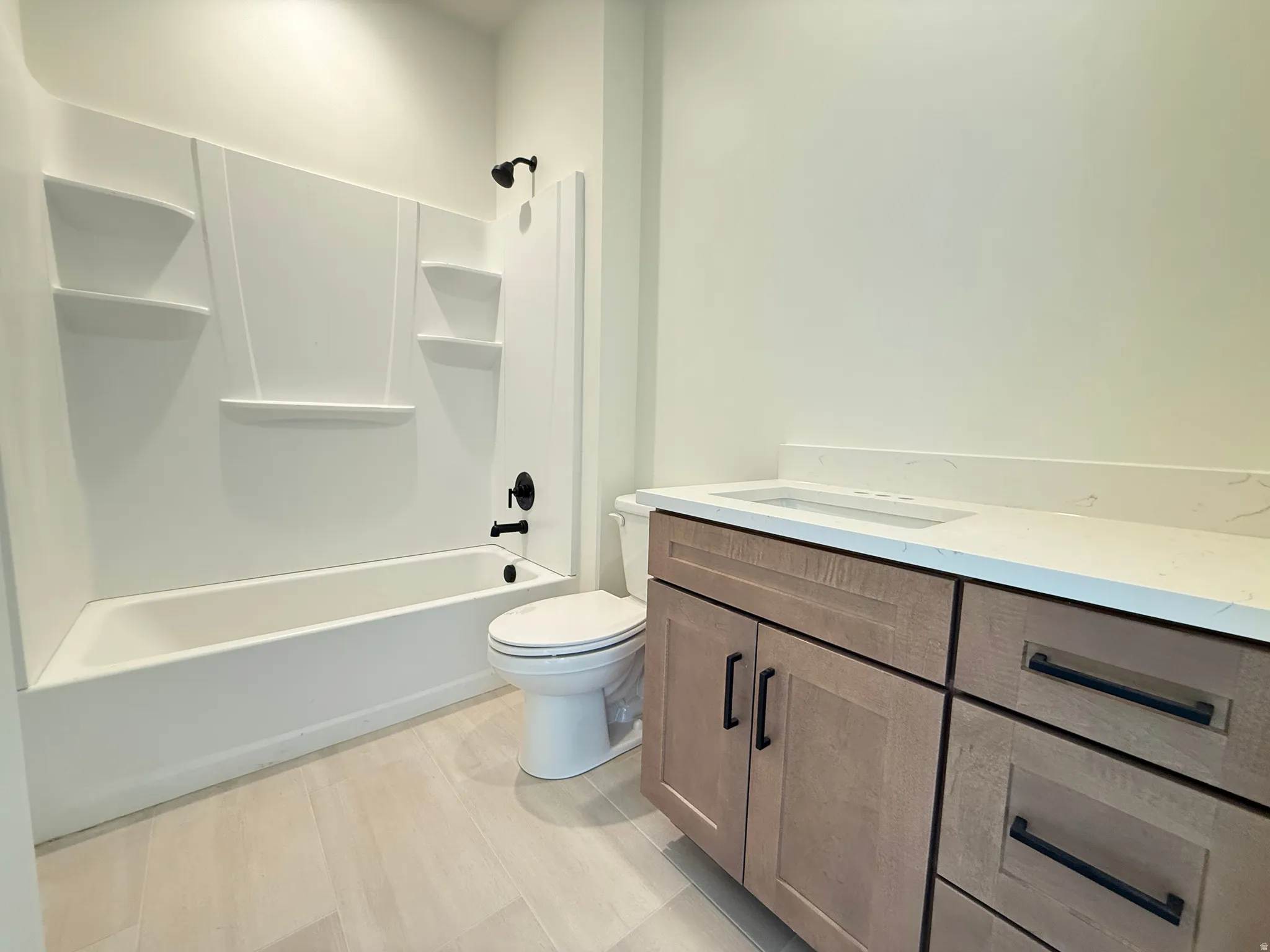 Full bathroom featuring vanity and washtub / shower combination