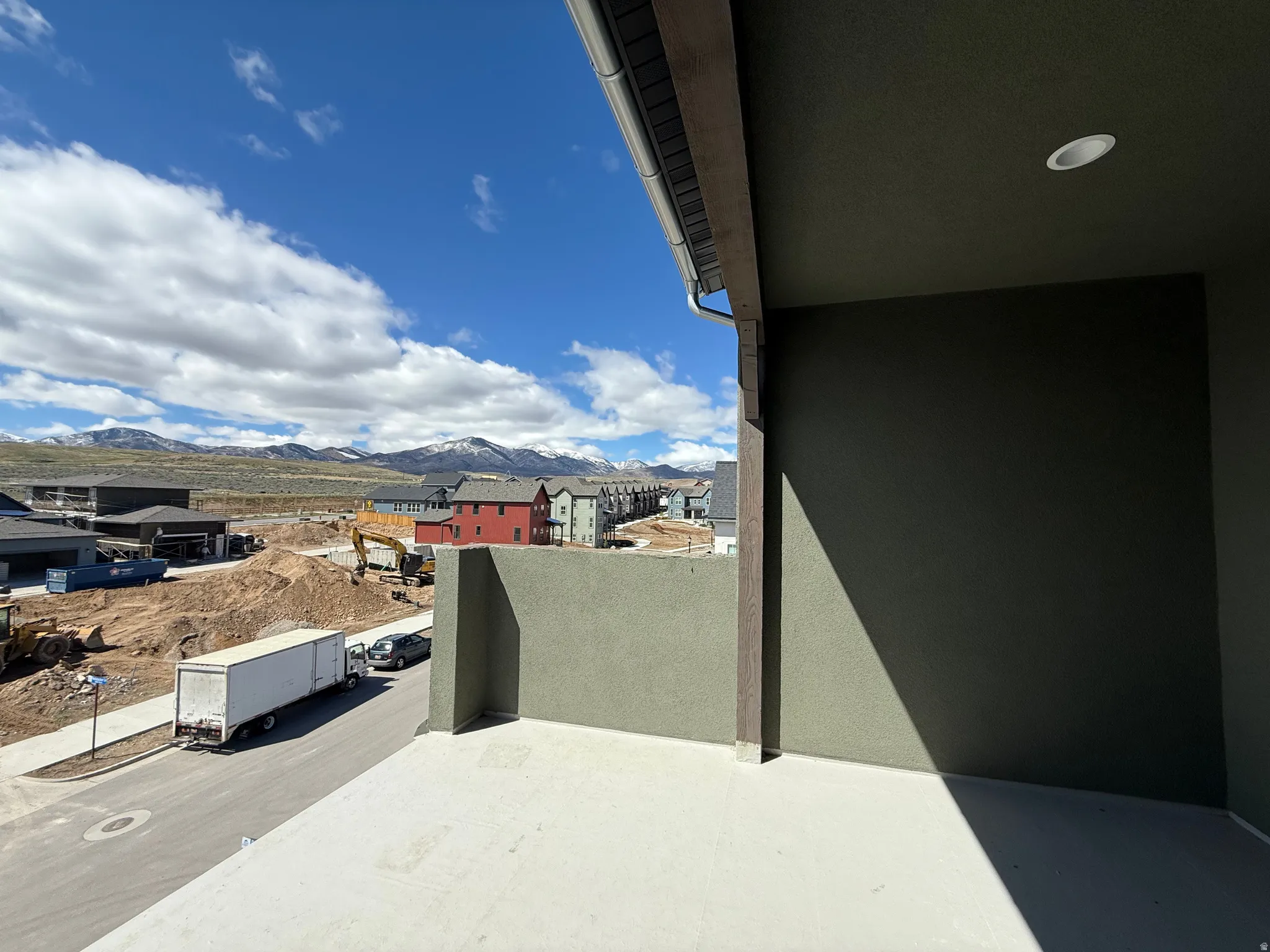 Balcony with a mountain view and a residential view