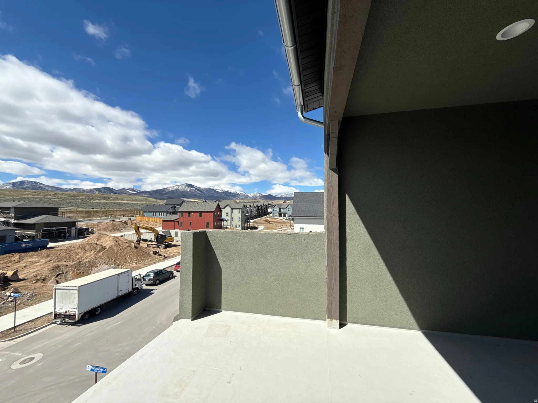 Balcony featuring a mountain view and a residential view